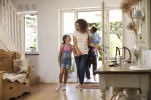 71214148 - family in hallway returning home together