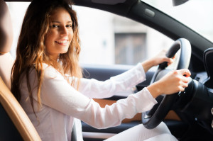 41808268 - young woman driving her car